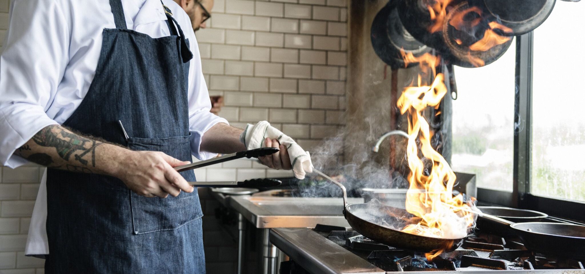 Chef cooking food in the restaurant kitchen